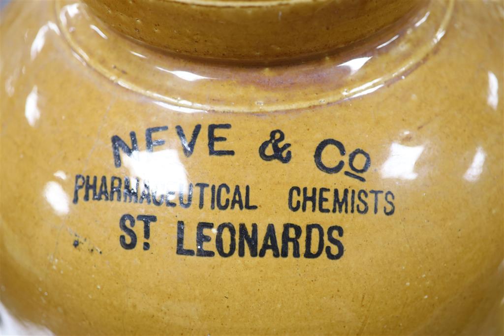 Hastings and St Leonards; a large stoneware pharmacy container and a smaller jar.